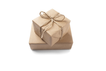Two boxes with gifts wrapped in Kraft paper on isolated white ba