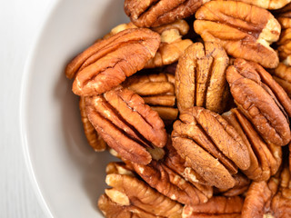 Pecan Nuts In White Bowl On Table
