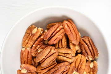 Pecan Nuts In White Bowl On Table