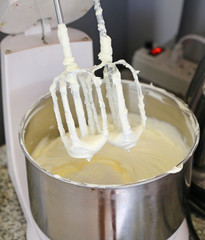 Making of a cream for home-made cakes on a mixer