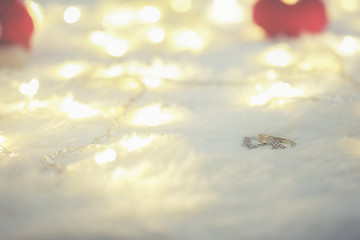 Two rings on wool Background.Soft focus,low light.(selective focus).