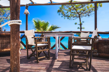 Seaside balcony with wooden furniture