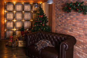 Christmas atmosphere in a cozy decor interior with a sofa and a