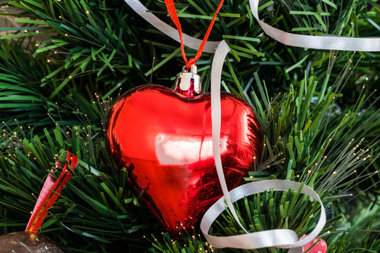 heart shape christmas tree toy on artificial fir