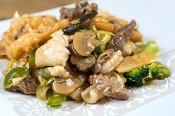 wok fried chicken stir fry with sweet peppers and chinese vegeta