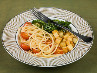 Spaghetti with Cherry Tomatoes Potatoes and Rocket Leaves
