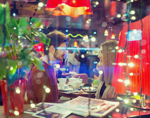 Young romantic couple in the restaurant at night