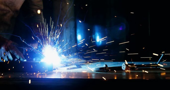Welder welding a metal
