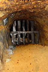 Gold - old roman tunnel in gold mine Rosia Montana, Transylvania.The rich mineral resources of the...