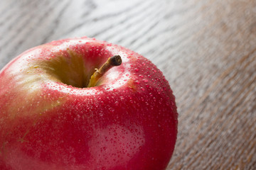 Red apple closeup on  table