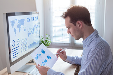 Investor analyzing financial reports and key performance indicators