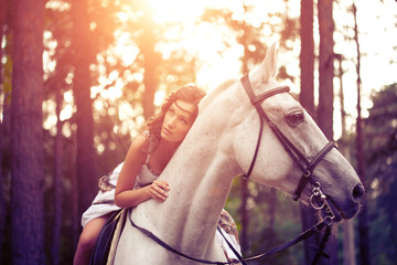 Young woman on a horse. Horseback rider, woman riding horse