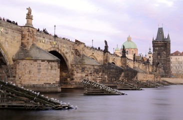 Architecture from Charles bridge in Prague with cloudy sky