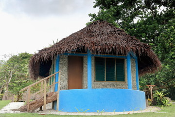 Fototapeta na wymiar Blue thatched bungalow in Lonnoc Beach. Espiritu Santo island-Vanuatu. 7005