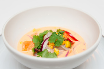 Sea bass ceviche with pumpkin, cilantro, corn and onion