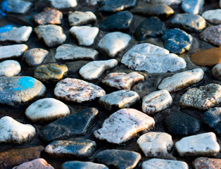 Closeup of old street gravel pavement texture