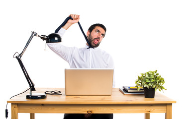 Businessman in his office drowning himself