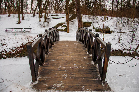 Bridge across frozen river in park Sofievka (Uman, Ukraine)