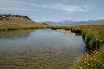 Fototapeta premium Wildlife Altai. The river, mountains and sky with clouds in summ