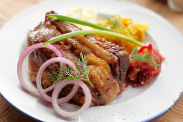 Grilled pork ribs with sauerkraut and mashed potatoes