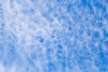 clouds in the blue sky as background