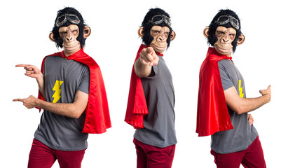 Superhero monkey man pointing to the front