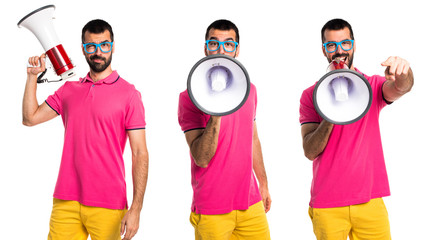 Man with colorful clothes shouting by megaphone
