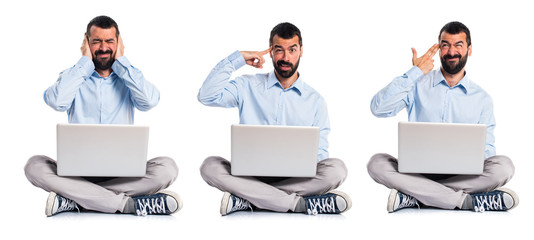 Man with laptop making crazy gesture