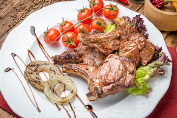 grilled beef steak on the grill on a wooden table