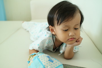 Fototapeta premium Baby ailing and lying in the hospital