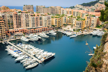 Monte Carlo harbour city panorama. View of luxury yachts and apartments in harbor of Monaco