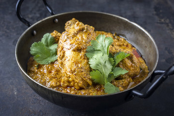 Traditional Indian Chicken Tikka Masala as close-up in Bowl