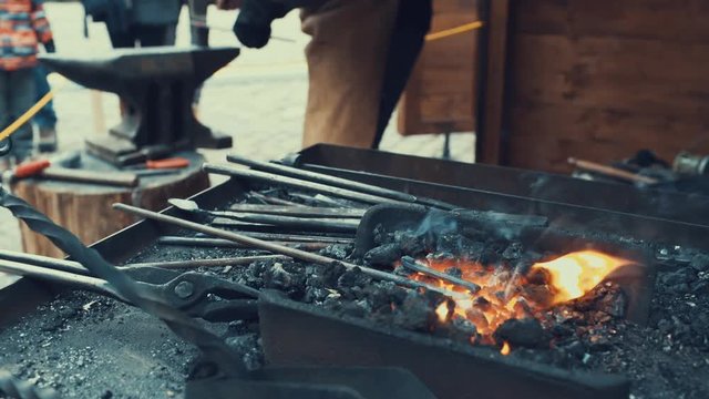 The furnace heats the metal in the fire. The equipment of a blacksmith.