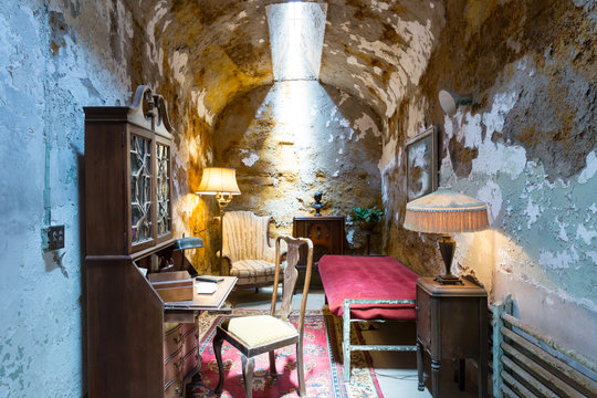 Old jail cell with furniture.