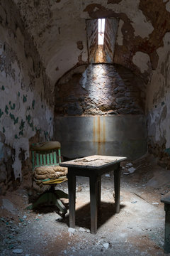 Old prison cell with little sunlight window