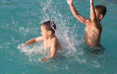 two boys bathing in the water park