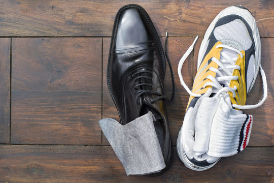 Work life balance - elegant business shoe (oxford style) and a running shoe