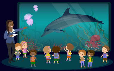 Obraz premium Children on an excursion to the aquarium