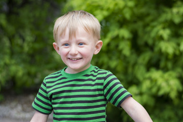 Happy young boy at the park