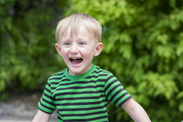 Happy young boy at the park