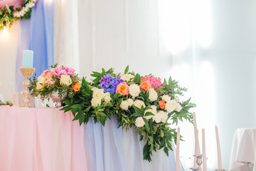 Wedding decor, table setting, floral arrangements in the restaurant