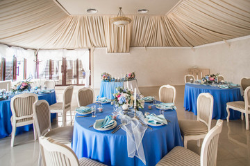 Wedding decor, table setting, floral arrangements in the restaurant