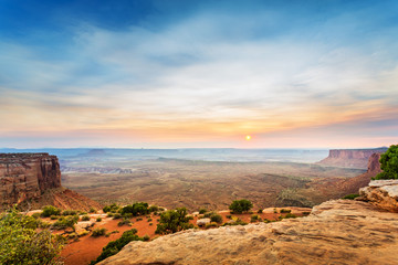 View from the top of sandstone mountain at sunset