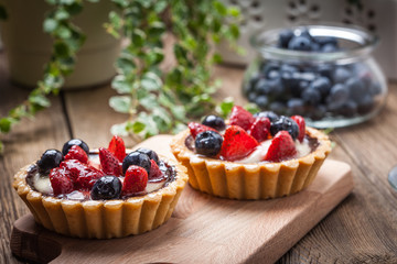 Fresh homemade fruit tart with strawberries and blueberries.