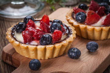 Fresh homemade fruit tart with strawberries and blueberries.