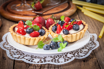 Fresh homemade fruit tart with strawberries and blueberries.