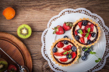 Fresh homemade fruit tart with strawberries and blueberries.