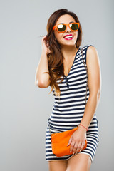 Naklejka premium Attractive girl at gray studio background