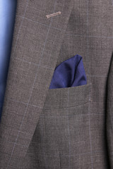 dark blue pocket square - handkerchief in the breast pocket of a man's wool luxury suit. vintage style.