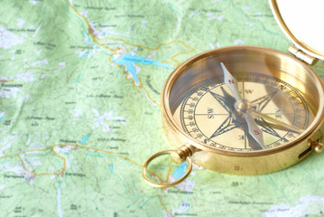 Golden compass on the map